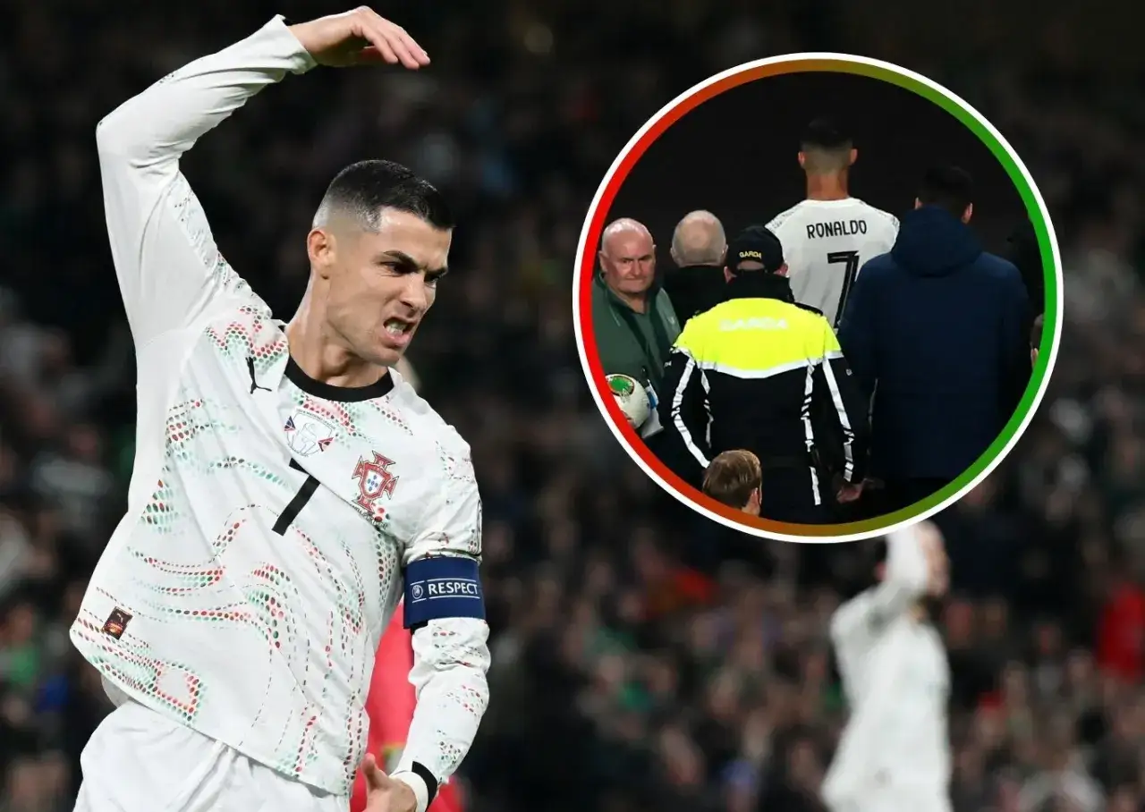 Piłkarz Cristiano Ronaldo w białej koszulce, z wyrazem frustracji na twarzy. W tle, w okręgu, widać go otoczonego przez ochronę, co sugeruje, że czerwona kartka na ile wyklucza go z gry.